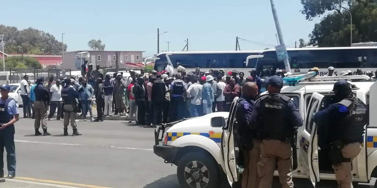 passengers pelted traffic officers in Masiphumulele after they attempted to clamp the bus they wanted to travel with