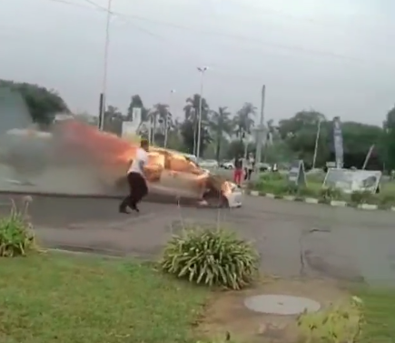 Burning car crashes onto petrol garage